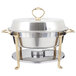 A Vollrath classic brass round chafer with brass and gold trim.