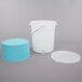 A white plastic beverage dispenser with a blue base.