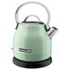 A KitchenAid pistachio electric kettle with a handle.