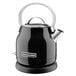 A black and stainless steel KitchenAid electric kettle.