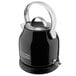 A black and silver KitchenAid electric kettle on a counter.