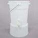 A white plastic beverage dispenser with a handle and a spout.