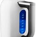 A white KitchenAid electric kettle with blue accents.