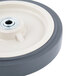 An 8" gray wheel with a black rim and a white center with a hole in it.