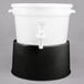 A white plastic beverage dispenser with a black base.