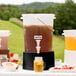 A Choice translucent beverage dispenser filled with fruit and drinks.