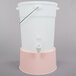 A white plastic water dispenser with a rose base and white lid and handle.