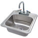 An Advance Tabco stainless steel drop-in sink.