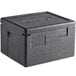 A black Cambro Cam GoBox top loading food pan carrier with a lid.