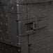 A black plastic latch on a black plastic box.