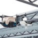 A metal rack with a white plastic S-hook hanging from it.