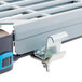 A MetroMax Q walk-in shelving unit with S-hooks.