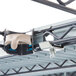 A metal rack with a metal bar with a white plastic hook on the end.