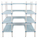 A white MetroMax shelving unit with blue shelves and S-hooks.