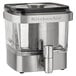 A silver and black KitchenAid stainless steel coffee maker.