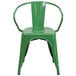 A green metal outdoor restaurant chair with arms and a vertical slat back.