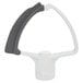 A KitchenAid flex edge beater with a white and grey handle.