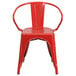 A red metal Flash Furniture chair with arms and a vertical slat back.