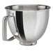 A KitchenAid polished stainless steel mixing bowl with a handle.