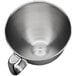 A close-up of a silver stainless steel KitchenAid mixing bowl with a handle.