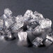 A group of cubelet ice pieces on a table.