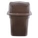 A brown plastic Continental trash can with a lid.