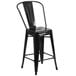 A Flash Furniture black galvanized steel counter height stool with a vertical slat back.