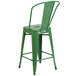 A green metal Flash Furniture counter height stool with a vertical slat backrest.