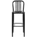 A Flash Furniture black metal bar stool with a vertical slat back.