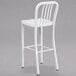 A Flash Furniture white metal bar stool with a backrest.