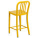 A Flash Furniture yellow metal outdoor counter height stool with a vertical slat back.