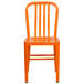 An orange metal chair with a vertical slat back.