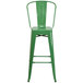 A Flash Furniture green galvanized metal bar stool with backrest.