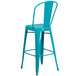 A teal blue metal bar stool with a vertical slat back.