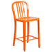 An orange Flash Furniture metal outdoor counter height stool with a vertical slat back.