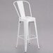 A white Flash Furniture galvanized steel bar stool with backrest.