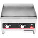 A Vollrath countertop gas flat top griddle with manual control on a counter.