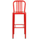 A Flash Furniture red metal bar stool with a vertical slat back.