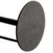 A black metal American Metalcraft round paper towel holder with two legs.