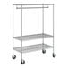 A chrome metal garment rack on wheels.