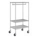 A Regency chrome wire garment rack with wheels.