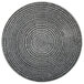 A white porcelain round coupe plate with a black and white circular pattern.