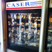 A store front with a Curtron display cooler strip curtain covering the entrance.