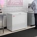 A white Galaxy CF7 commercial chest freezer with a 7 cubic foot capacity.