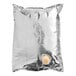 A silver Gehl's bag of Sharp Cheddar Cheese Sauce with a cap.