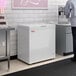 A white Galaxy CF5 commercial chest freezer with a 5.2 cubic foot capacity.