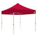 A red Caravan Canopy tent with white poles.