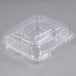 A Durable Packaging clear hinged lid plastic container with three compartments.