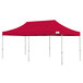 A red rectangular Caravan Canopy tent with white poles.