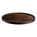 A Lancaster Table & Seating round wooden table top with espresso finish.